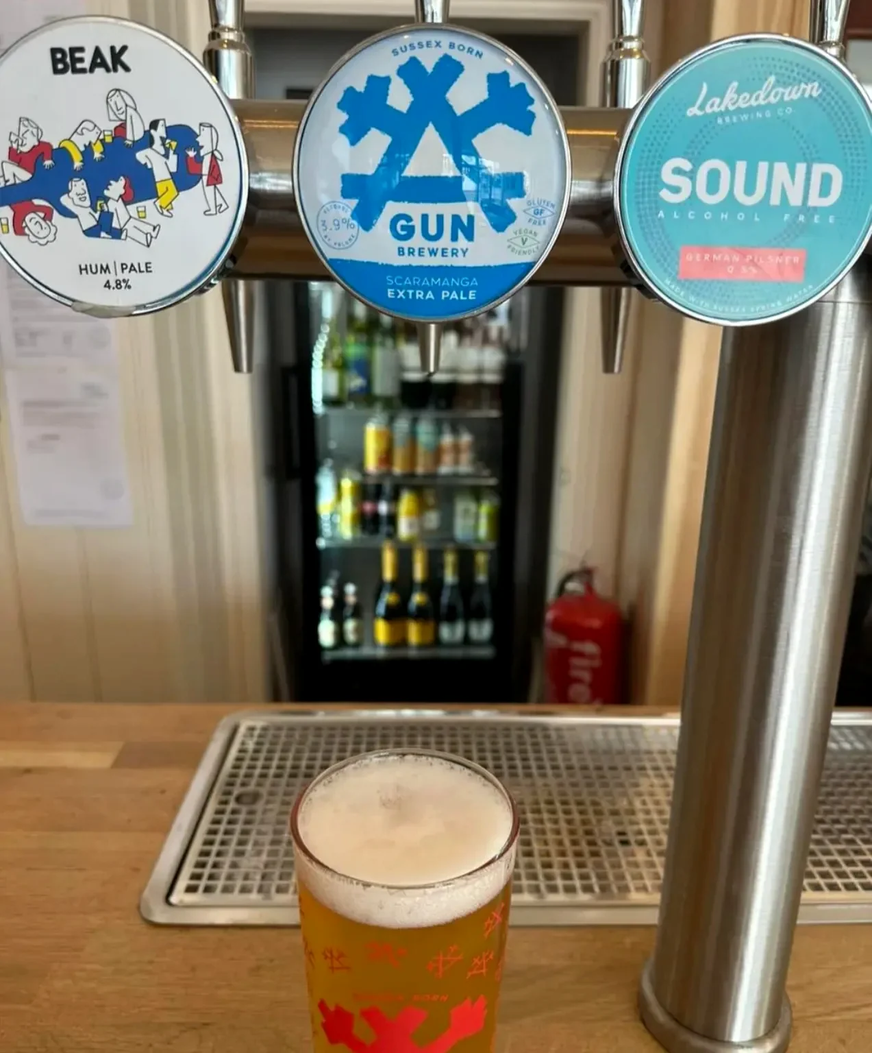 Beer pumps and a pint at Newhaven Tap